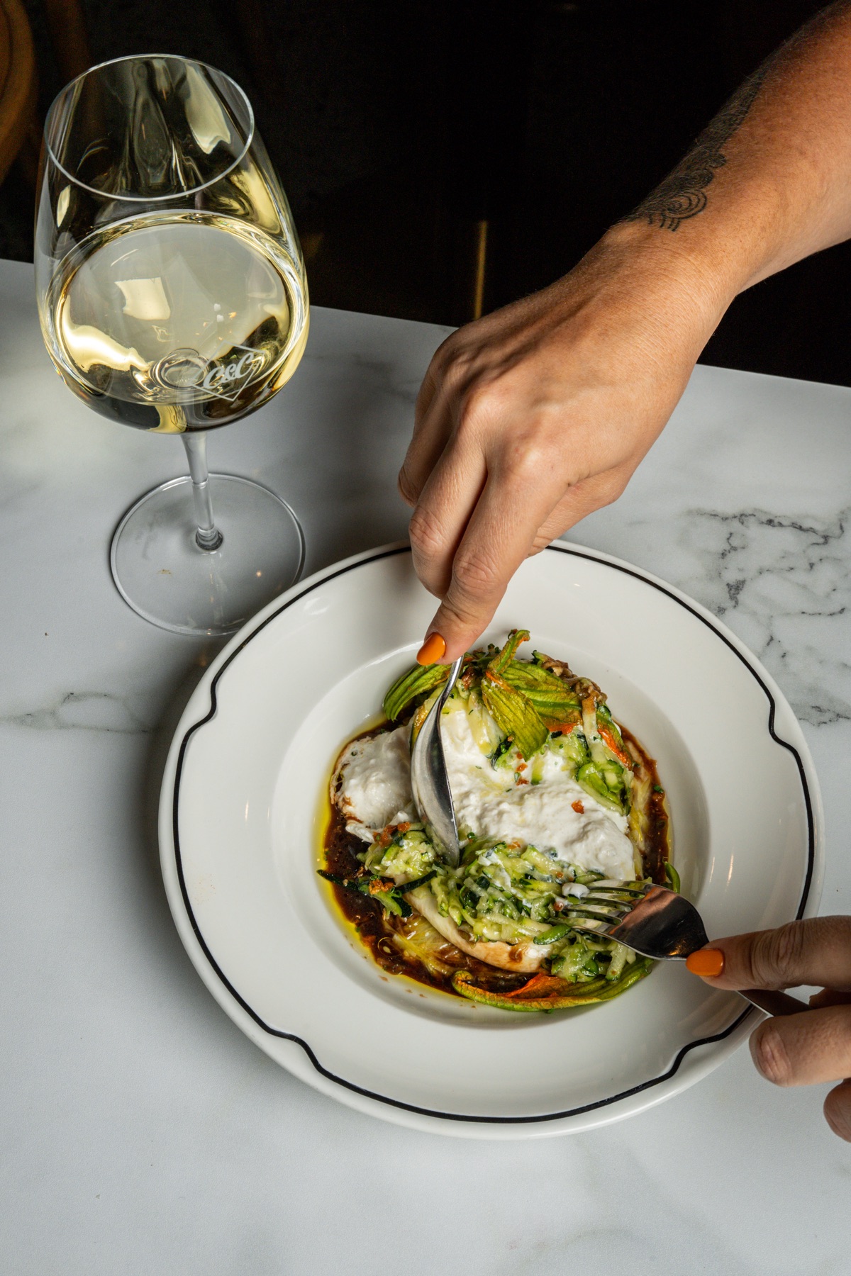 Burrata and zucchini flowers shared at the table