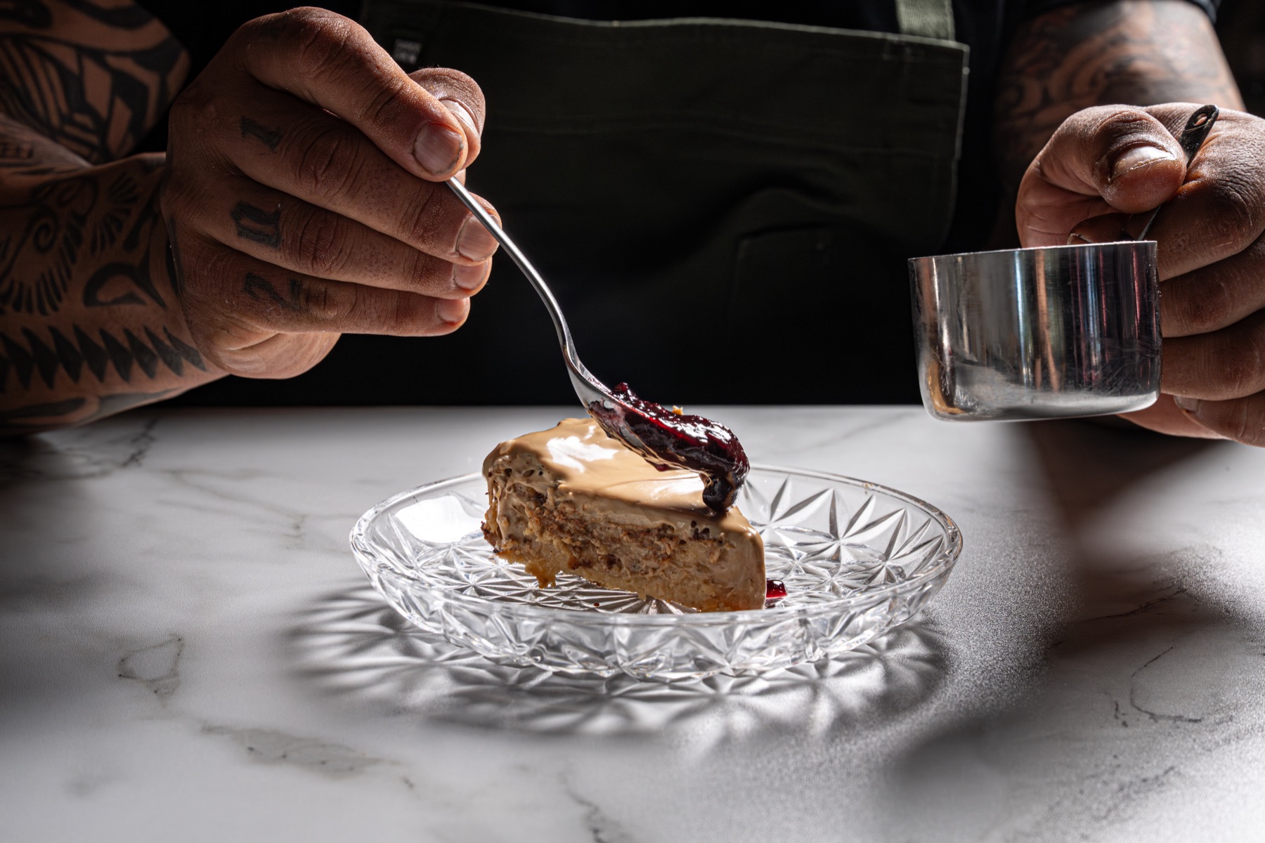 Nicola finishing a dessert by hand